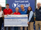 Paignton Sailing Club representatives claim their top prize in Sunsail's Funding the Future initiative 2026 with judges from Sunsail, the RYA, YachtsandYachting.com and PBO's Katy Stickland (second left)