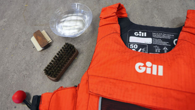A mildew stained buoyancy aid and cleaning kit ready. Credit: Gill/gb.gillmarine.com