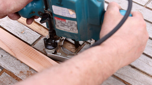 A router being used on a teak deck of a boat