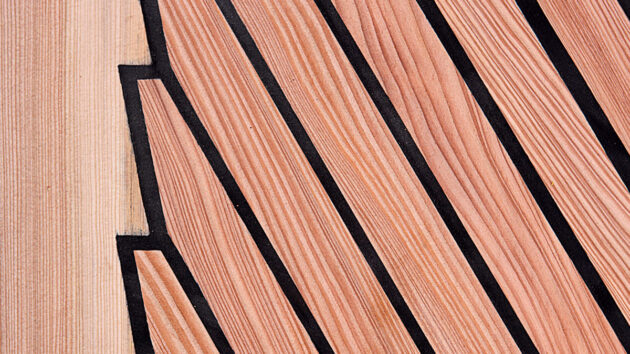 A newly caulked teak deck on a boat