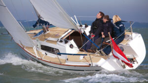People sitting in the cockpit of the Sunbeam 24.2 yacht