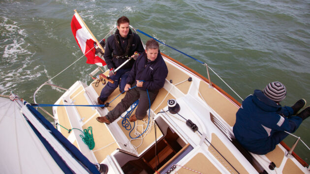 Two men sitting in a cockpit of a Sunbeam 24.2
