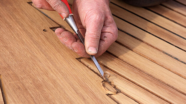 A man using a chisel
