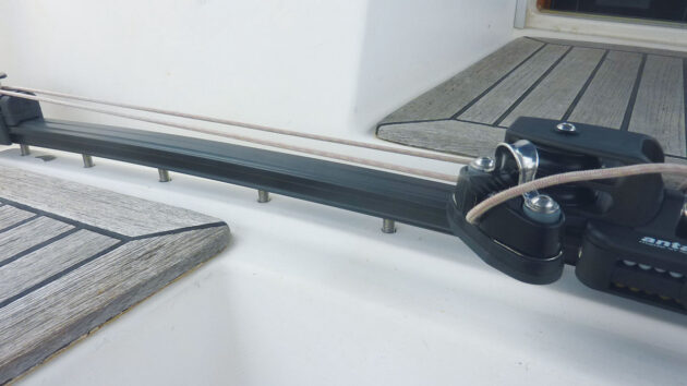 A mainsheet track being dry fitted to a boat's cockpit