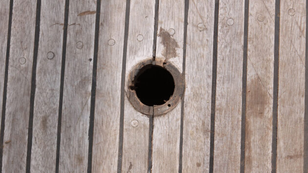 a hole in a teak deck