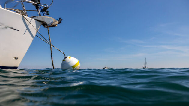 Studland bay eco mooring with yacht moored up. Credit: Brad Wakefield/The National Trust