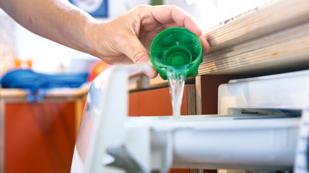 Adding Nikwax Tech Wash to a washing machine drawer. Credit: Nikwax