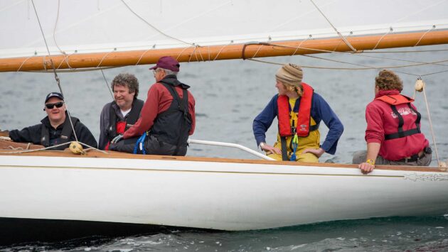 three men in a boat