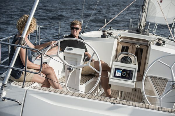 A couple sit on board a Bavaria yacht which has Navico elecrtonics on board