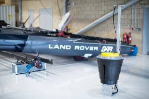 A Seabin next to the Land Rover BAR wing