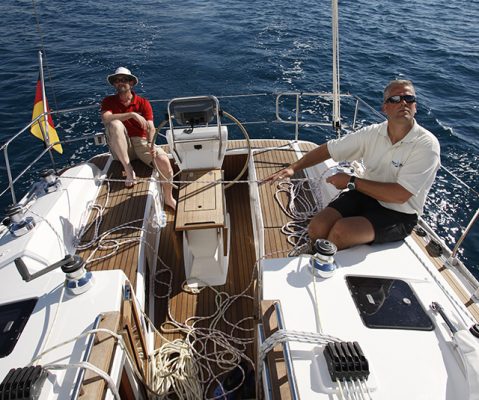 Two men on a boat sailing