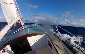 A yacht sailing in heavy seas which led to the solo skipper abandoning the boat for a liferaft