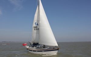 A yacht with wind in the sails
