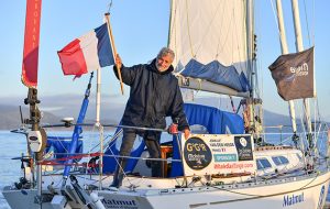 Jean Luc Van Den Heede waving from his boat