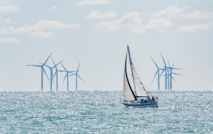 A yacht sailing in the middle of a windfarm