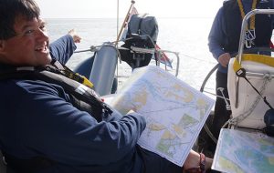 Sailor Jonty Pearce reading a chart