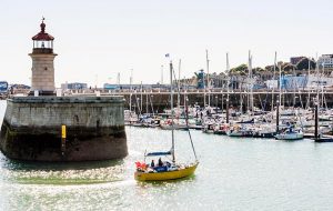 A yacht entering Ramsgate Harbour
