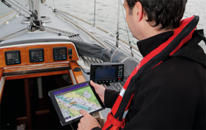 A skipper using an AIS app while on board his yacht
