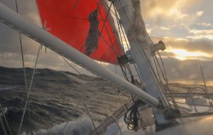 A yacht sailing in heavy weather