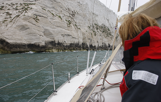 A yacht close to rocks