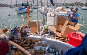 A woman sorting out food on deck