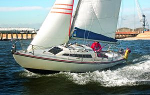 A skipper taking a yacht offshore