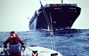 A container ship approached a sinking catamaran in the Atlantic