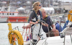 A woman during her Day Skipper course helming