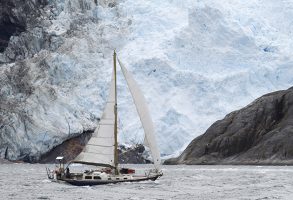 Nicholson 32 'Beduin' running past Ventisquero Italia of Cordillera Darwin, Brazo Noroeste of Beagle Channel, Tierra del Fuego, Chile
