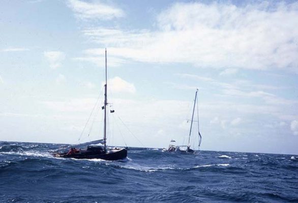 A yacht towing another boat