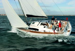 An ICC skipper at the helm of a yacht in Spain