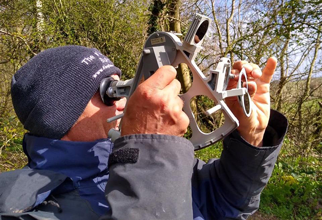 A sailor using a sextant