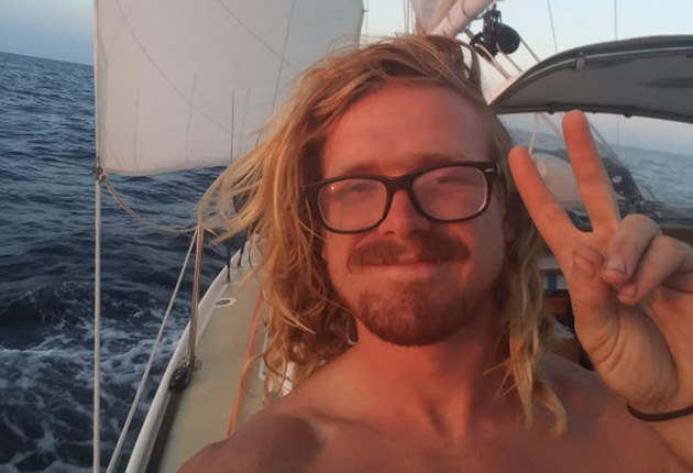 A skipper on a boat sailing