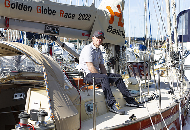 Ian Herbert-Jones sitting on the deck of Puffin