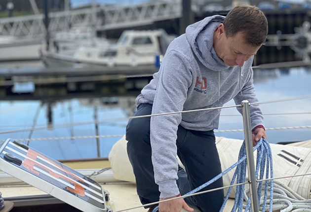 A sailor on the deck of his Tradewind 35