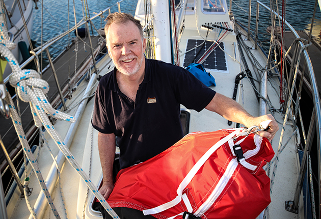 Mark Sinclair with a sail bag