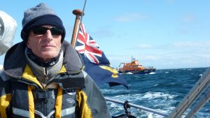 Pete advises 'Always carry an expert helm' like his friend Mike (pictured) with Cambeltown Lifeboat. Credit: Pete John