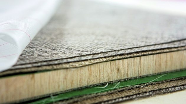 Pre-preg flax fibres being laid up around a balsa core