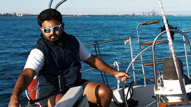 Gaurav Shinde helming a yacht ahead of the 2022 Golden Globe Race