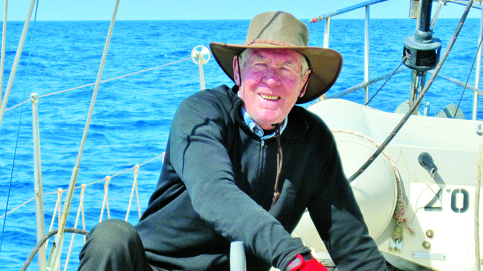 Rod Heikell wearing a hat on the deck of the boat