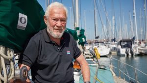 Sir Robin Knox Johnston sitting on Suhaili