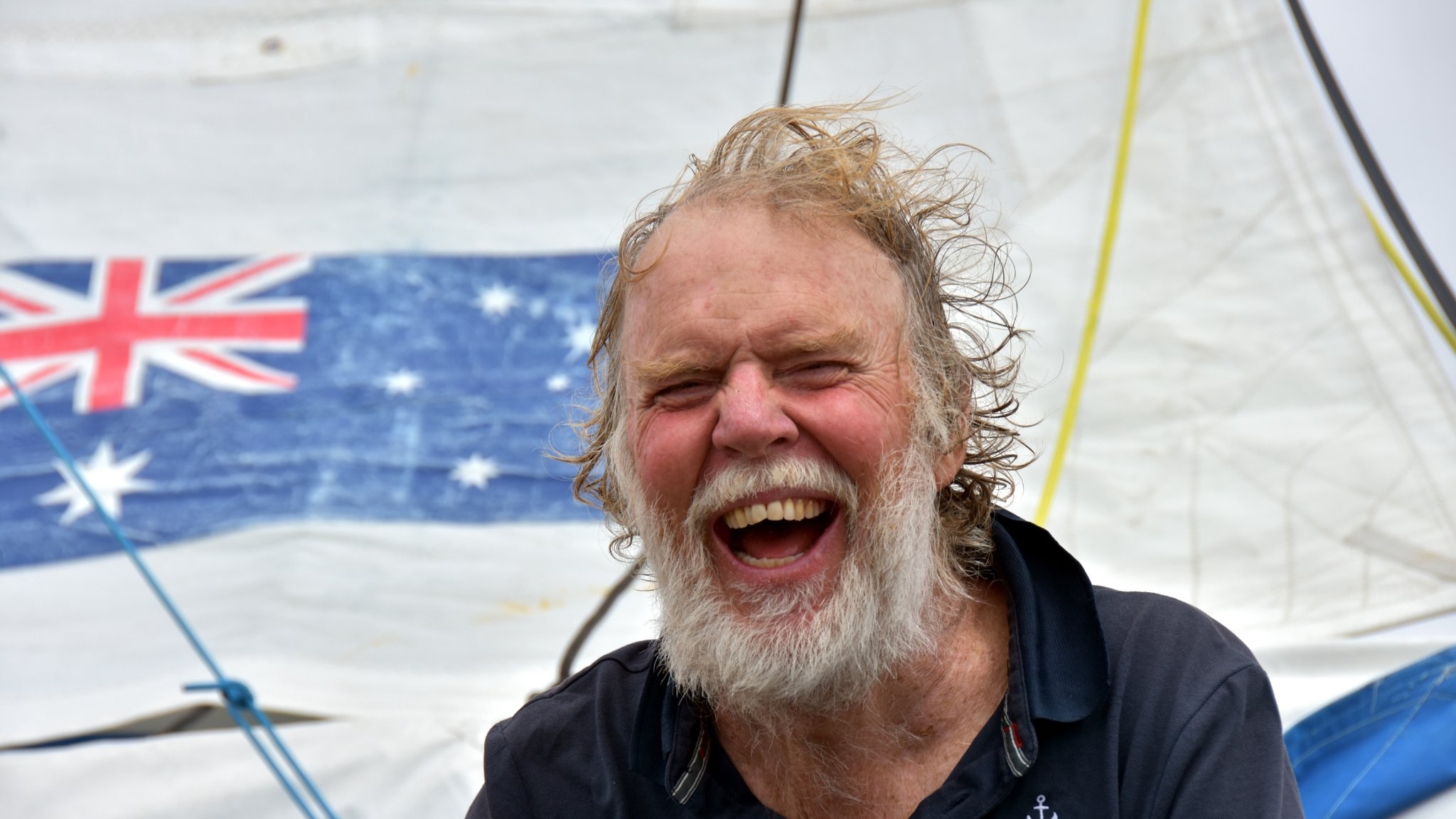 Always smiling!  A jubilant Mark Sinclair after becoming the 6th finisher in the 2018 Golden Globe Race. Credit: Bernard Gergaud