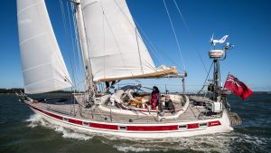 A deep fore-foot, encapsulated long fin keel, and rudder protected by a large skeg means the Najad 390 doesn't pound to windward. Credit: Richard Langdon