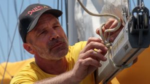 2022 Golden Globe Race skipper Michael Guggenberger working on his sail