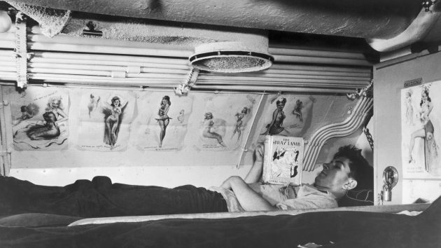 A soldier in the second world war reading a book