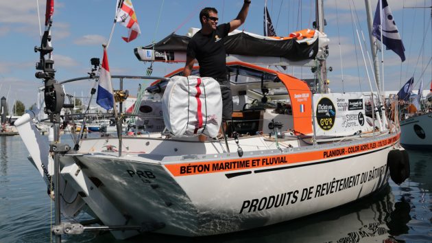 A sailor waving as he leaves the pontoon