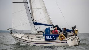 A Sadler 26 sailing in the south coast, with white sails