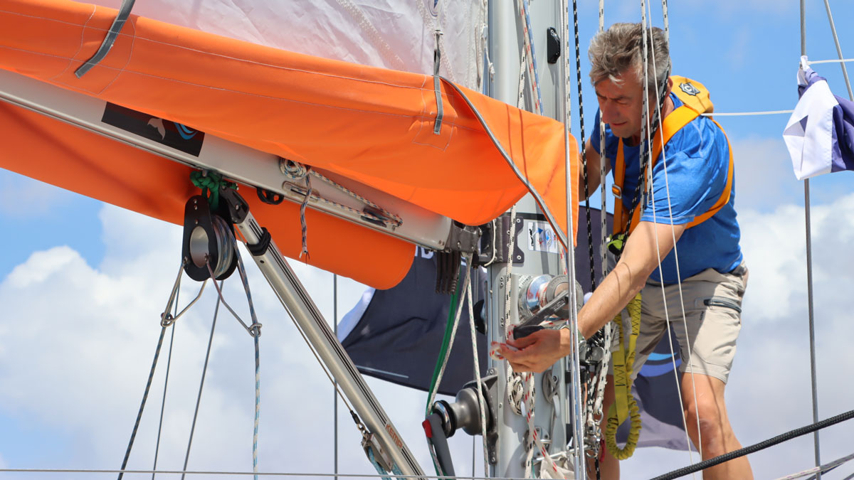 Ertan Beskards working on his sail during the 2022 Golden Globe Race