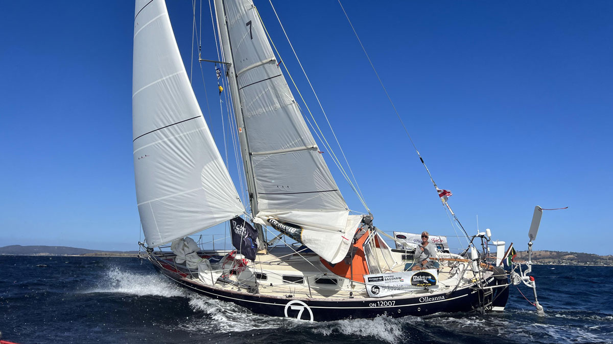 a boat sailing through the water without barnacles on its hull