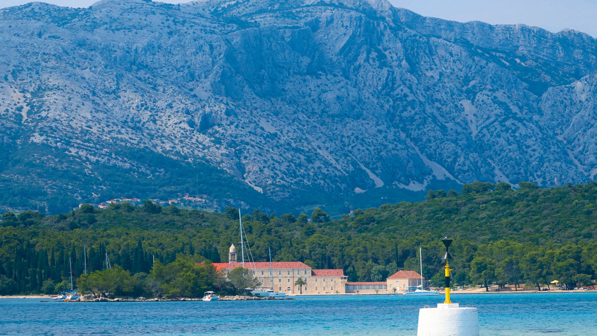 Korčula, the anchorage near the monastery with a mountain behind